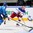MINSK, BELARUS - MAY 14: Russia's Yevgeni Kuznetsov #92 makes a pass while Kazakhstan's Alexei Litvinenko #5 defends and Alexei Ivanov #28 looks out from his goal during preliminary round action at the 2014 IIHF Ice Hockey World Championship. (Photo by Andre Ringuette/HHOF-IIHF Images)

